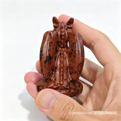Rear view of natural mahogany obsidian dragon statue 7cm height showing symmetric wing details and spine texture