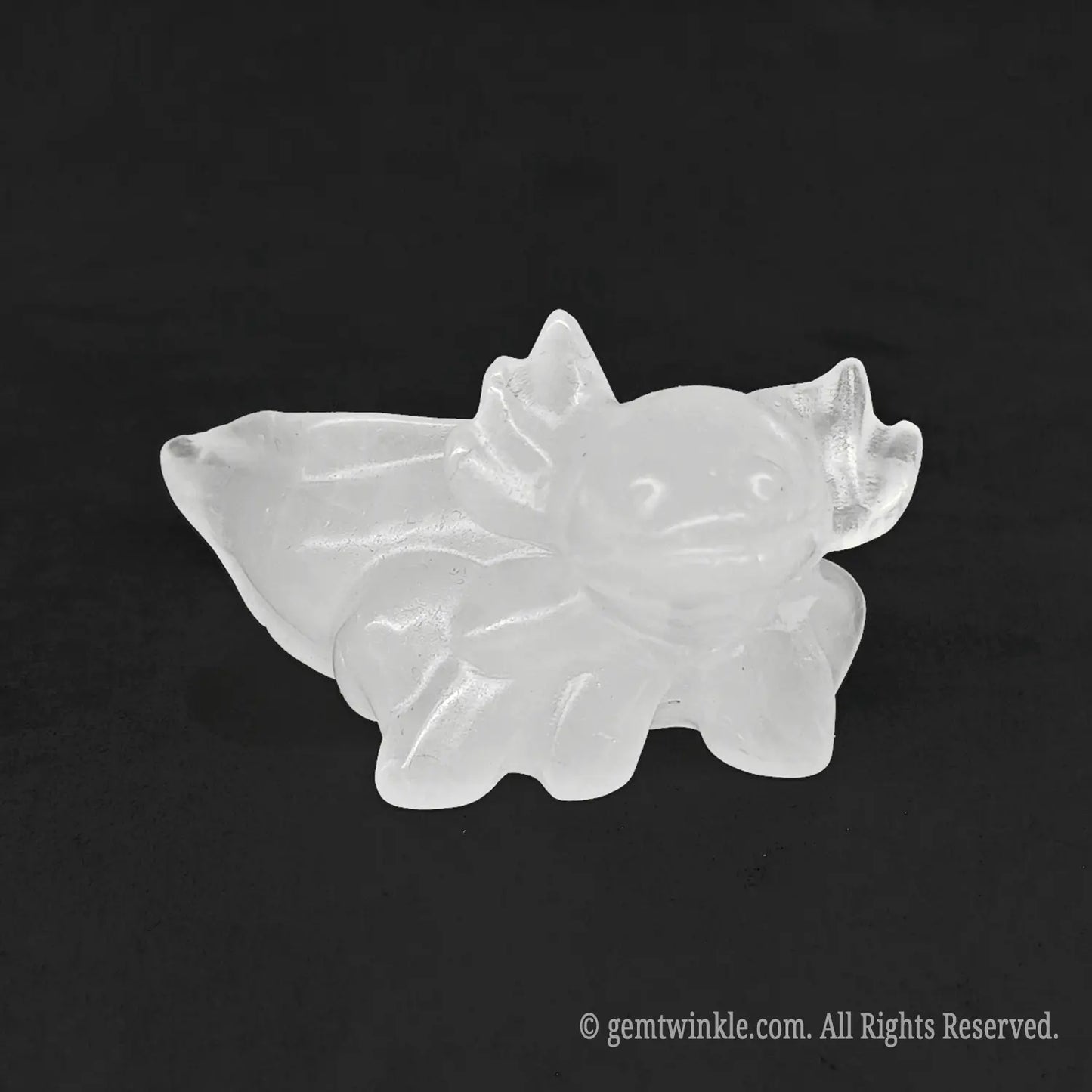 Front perspective view of a solid milky quartz axolotl salamander figurine displaying natural cloudy white textures