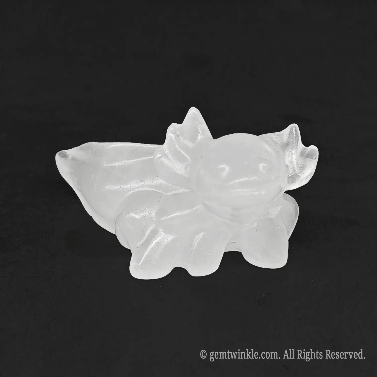 Front perspective view of a solid milky quartz axolotl salamander figurine displaying natural cloudy white textures
