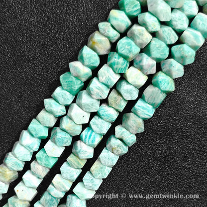 Close up view of mint green amazonite tube cylinder beads showing white veining
