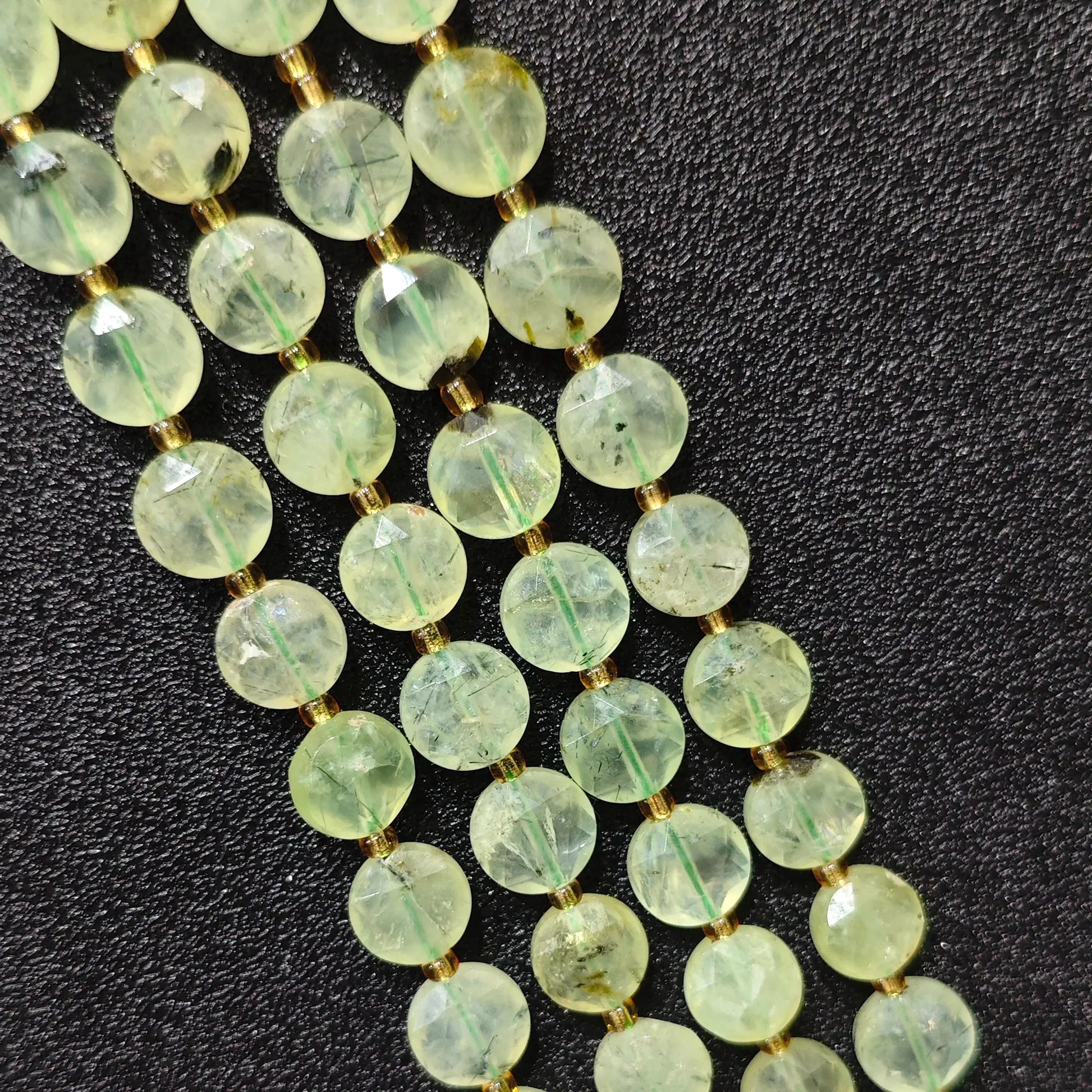 Strands of mint prehnite hexagram disc beads with natural black epidote inclusions