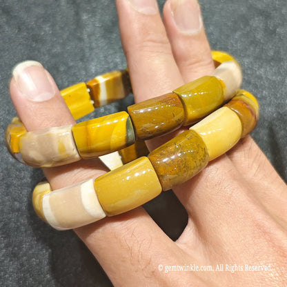 Full view of a mookaite jasper barrel bead wristlet displaying smooth geometric bead shapes and earthy colors