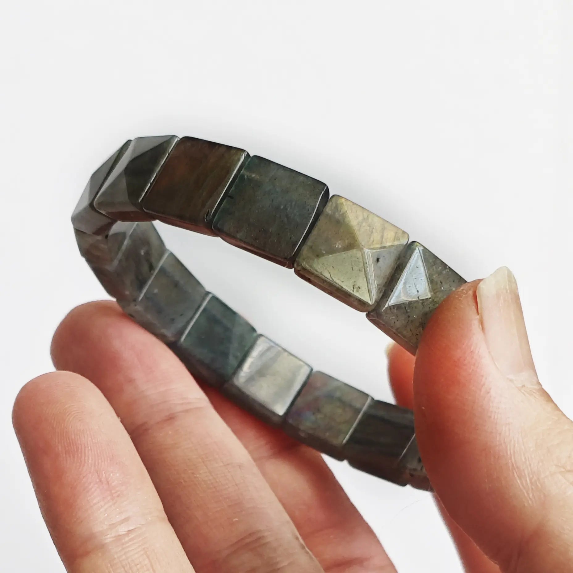 Moonstone bracelet displaying adularescence—shifting blue-green iridescence under light