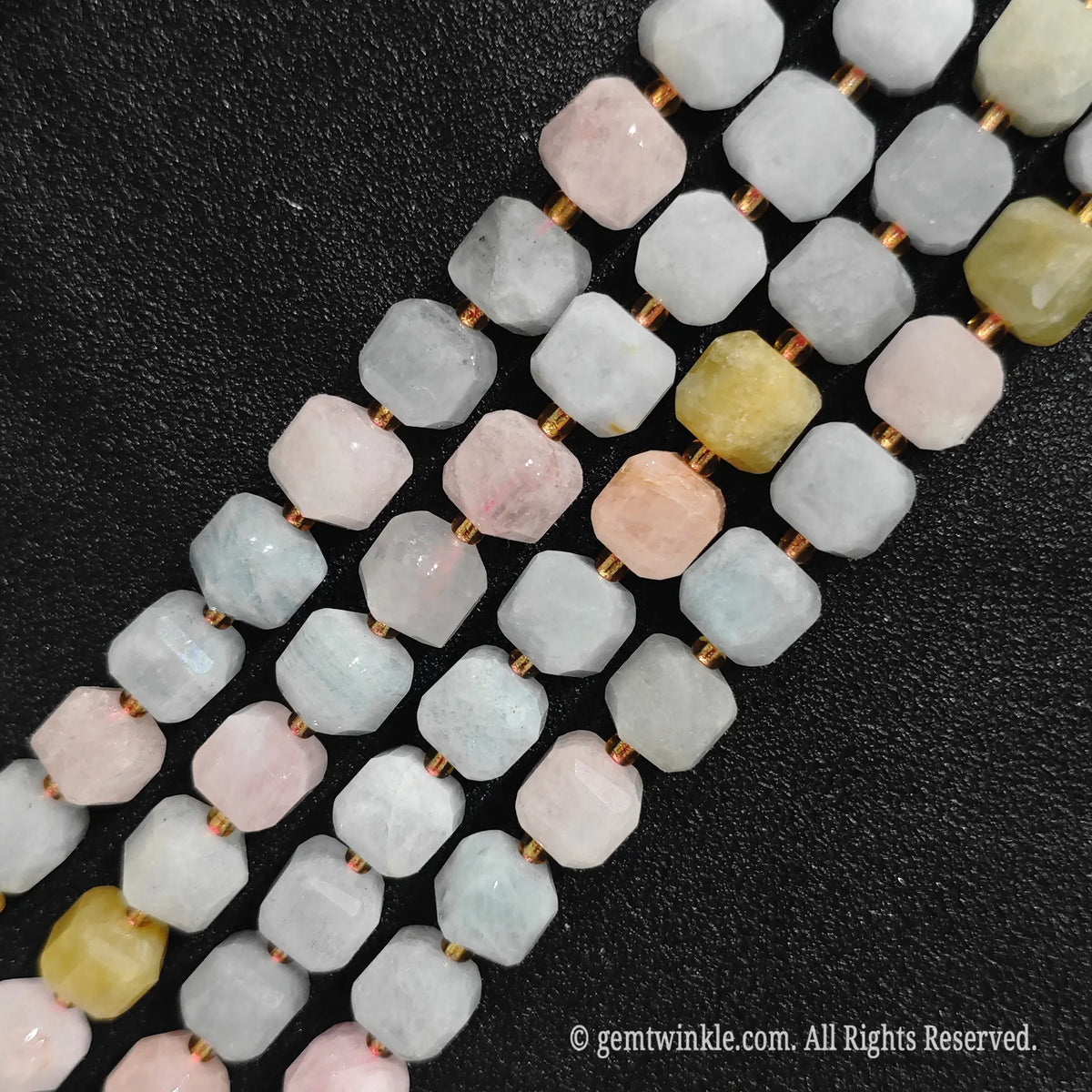 Close up view highlighting the soft pastel pink and peach tones of morganite blocks