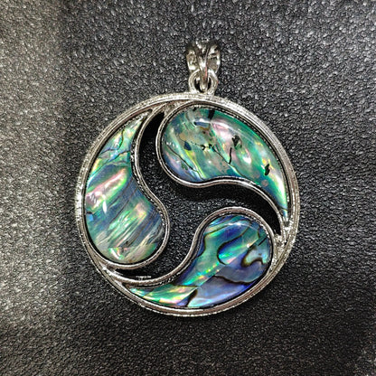 Composite mosaic abalone shell pendant 40mm with patchwork rainbow inlay in silver alloy triskele frame