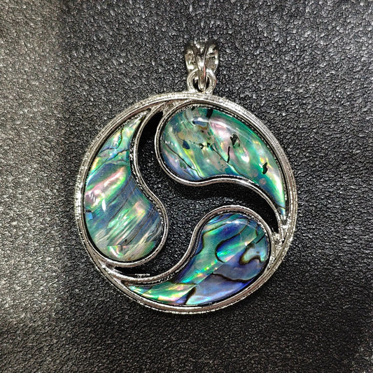 Composite mosaic abalone shell pendant 40mm with patchwork rainbow inlay in silver alloy triskele frame