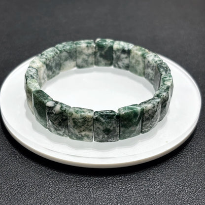 Multiple angles of the natural green moss agate bamboo bracelet, showcasing the different patterns and colors in the stones.