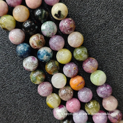 multi-color-tourmaline-beads-finger-scale-view