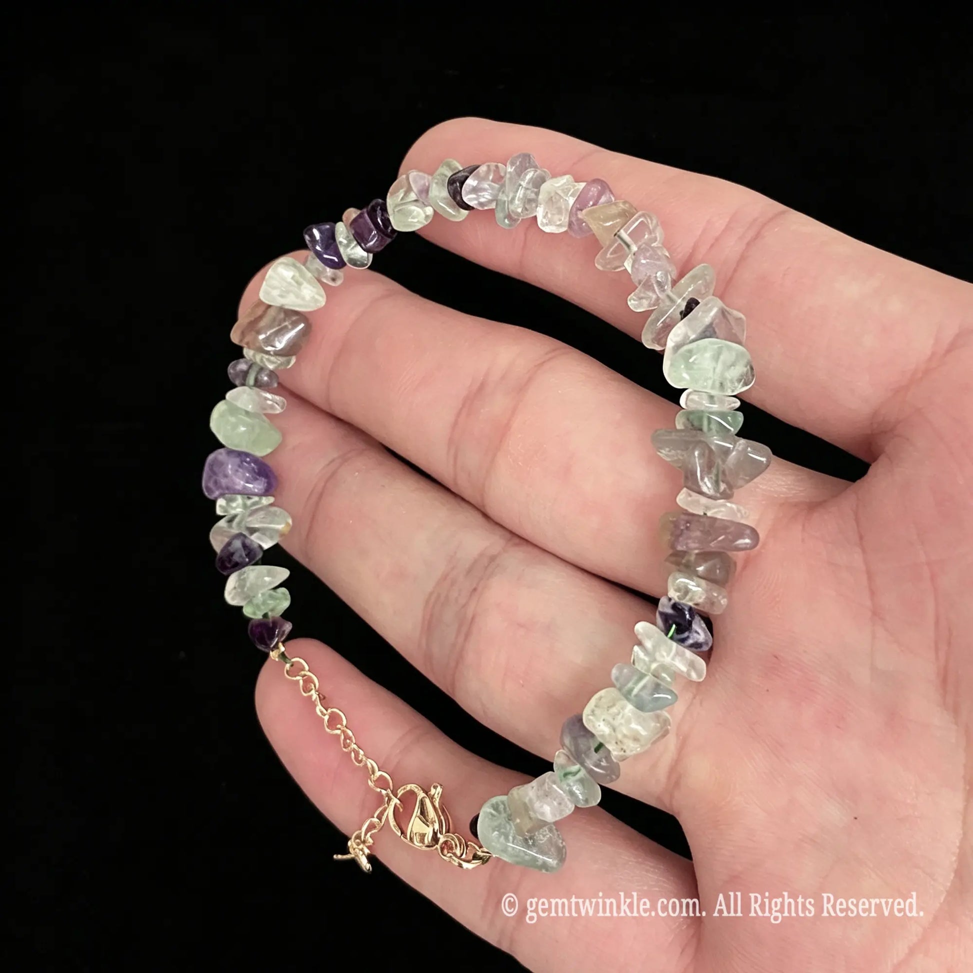 multi color fluorite raw chip nugget bracelet displayed on hand showing pastel gemstone hues
