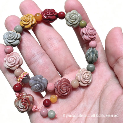 Full handheld layout of natural Alxa Gobi agate carved floral bracelet with earth tone beads