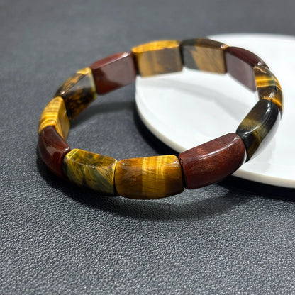 Multicolor Tiger Eye Bangles placed side by side on a white plate, comparing color variations and bead alignment.