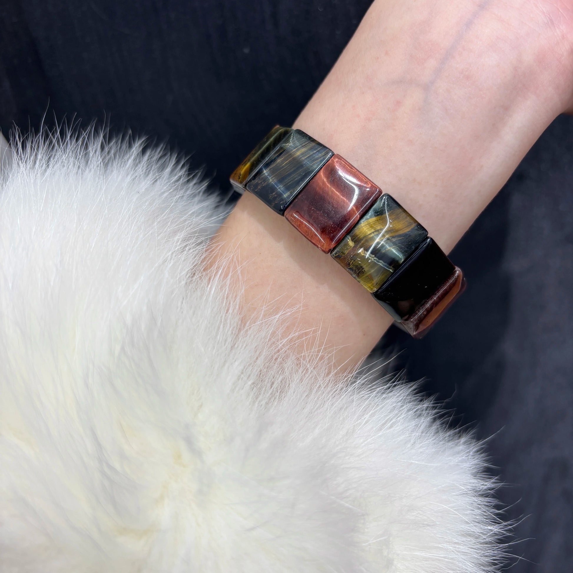 Woman wearing Natural Multicolor Tiger Eye Bangle Bracelet on wrist, Boho style jewelry
