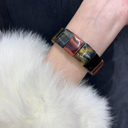 Woman wearing Natural Multicolor Tiger Eye Bangle Bracelet on wrist, Boho style jewelry