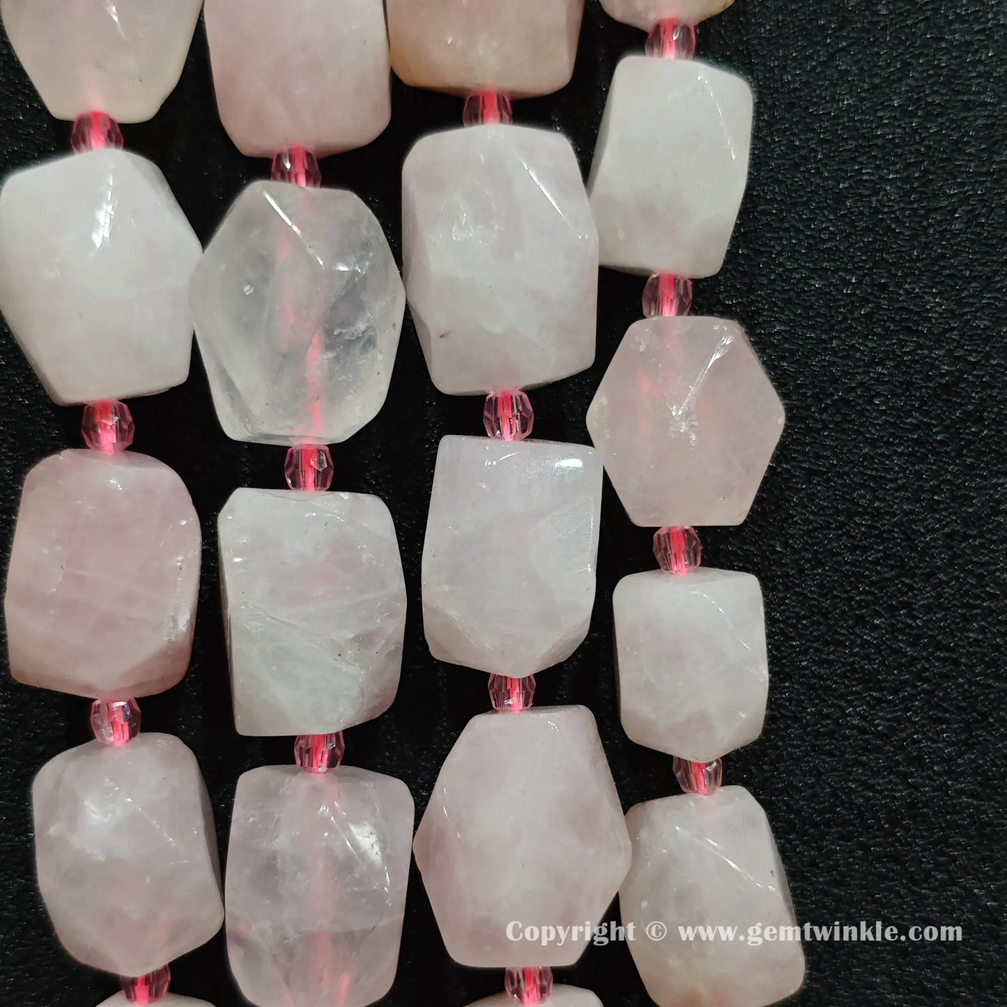 multiple strands of faceted rose quartz focal beads held together