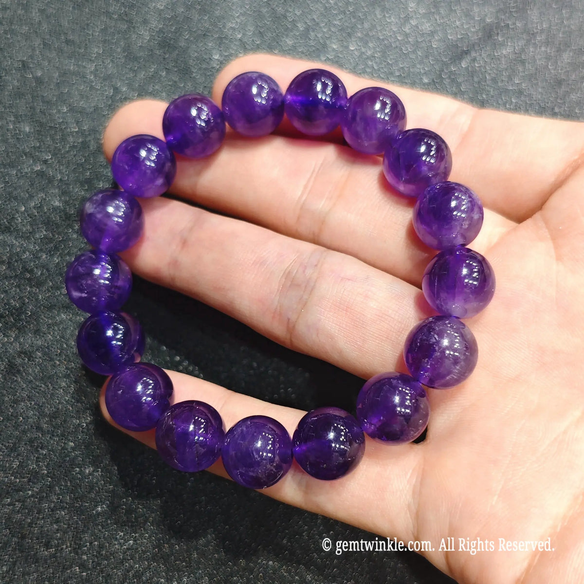 Perspective view of natural amethyst quartz spheres showing translucent violet tone and subtle internal feathering