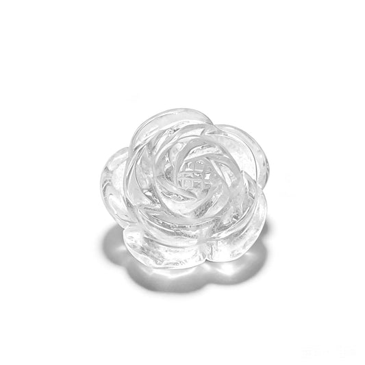 Natural clear quartz rose flower carving bead with center drill hole on isolated white background for jewelry design