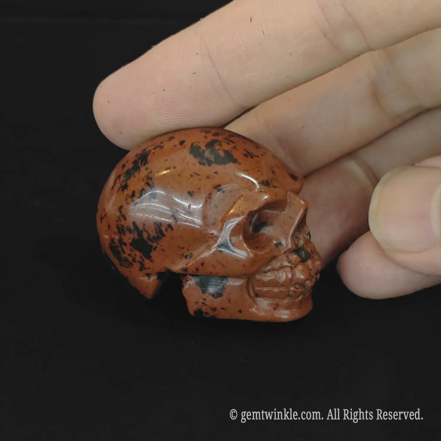 natural red obsidian skull close-up