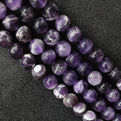 Macro detailed shot of natural dream amethyst loose round beads fresh batch with vivid contrast and zero yellowing tint