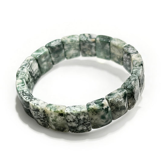  A high-quality natural green moss agate bamboo bracelet featuring green and white inclusions on an elastic band, perfect for stackable jewelry.