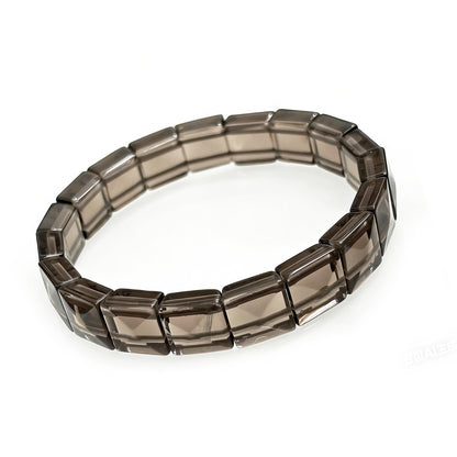 Close-up of natural icy obsidian rectangular bead bracelet, showcasing smooth faceted texture and translucent smoky color, Gem's Twinkle brand.