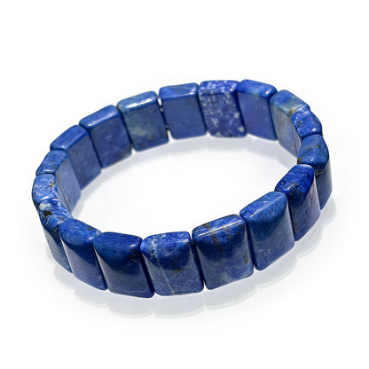 A high-quality natural lapis lazuli bamboo bracelet featuring deep blue stones with golden flecks on an elastic band, perfect for stackable jewelry.