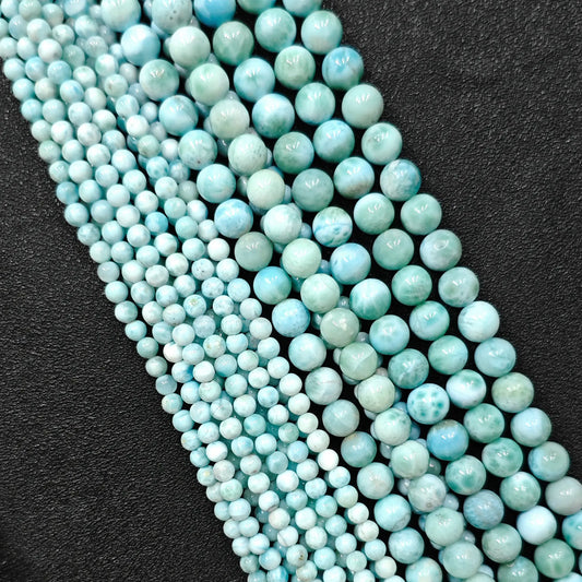 Natural larimar crystal beads grade b plus showing beautiful blue wave patterns in small strands