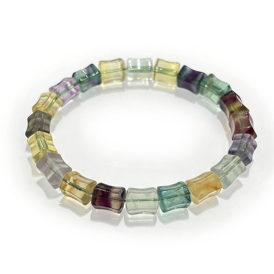 A high-quality natural multicolor fluorite bamboo bracelet featuring green, purple, and yellow stones on an elastic band, perfect for stackable jewelry.