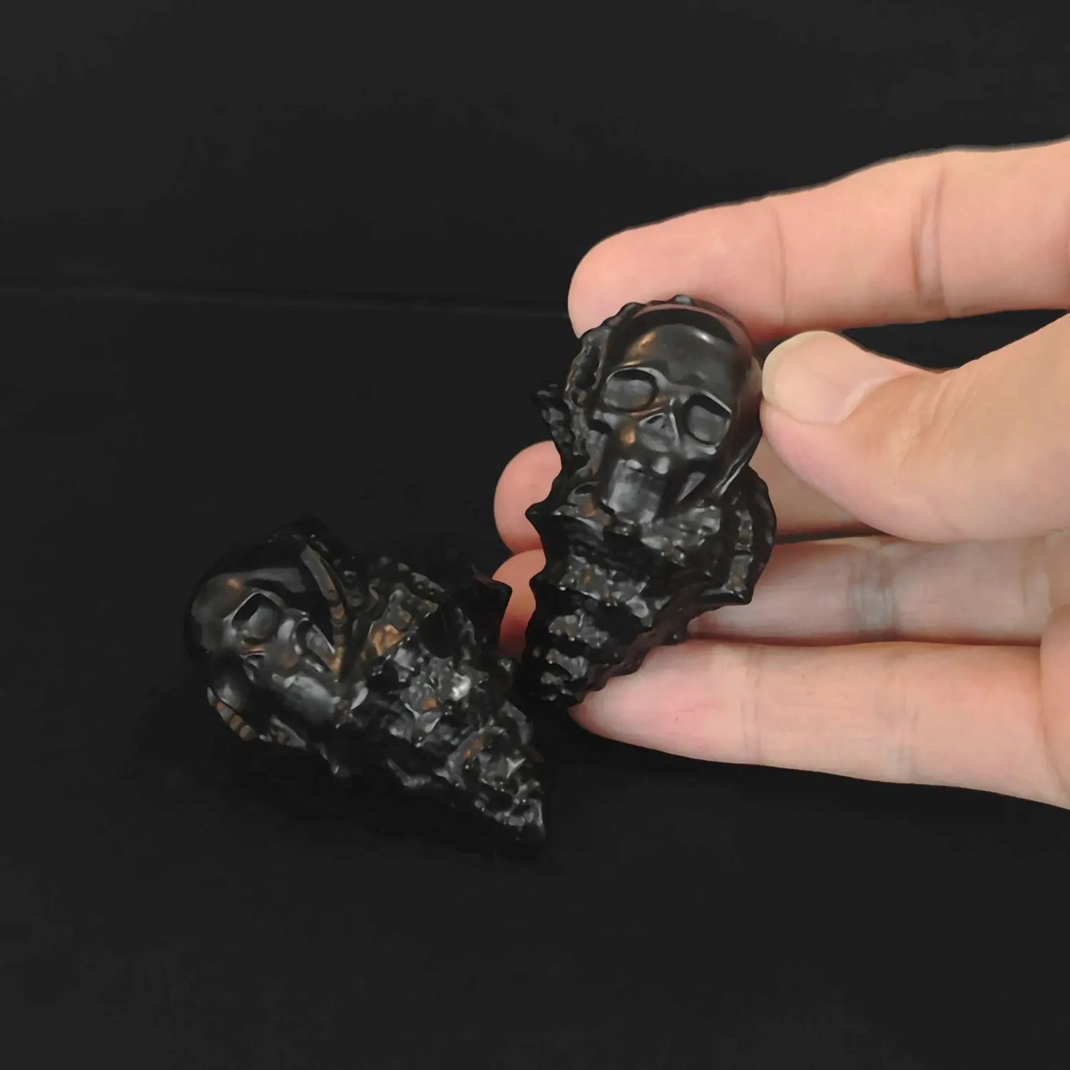 Natural obsidian conch skull carving shown from image_36df67.jpg with high-polish black finish