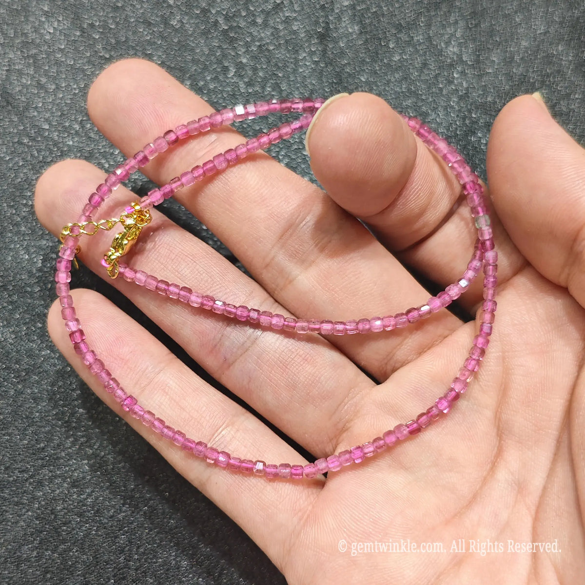 Detailed macro view of 2.5mm square cube Pink Tourmaline beads showing translucent rose pink gemstones