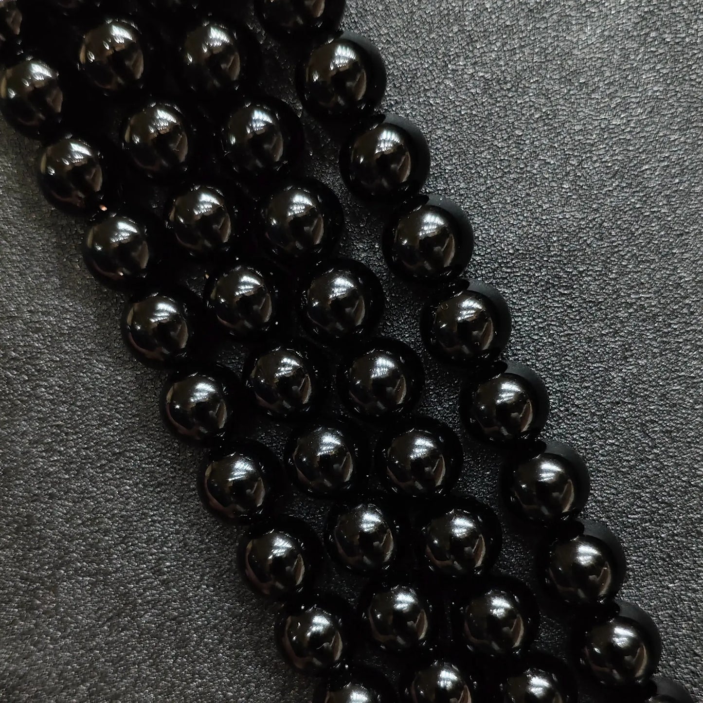 Natural pure black obsidian crystal beads round strands in a high gloss mirror finish