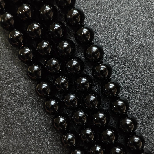 Natural pure black obsidian crystal beads round strands in a high gloss mirror finish