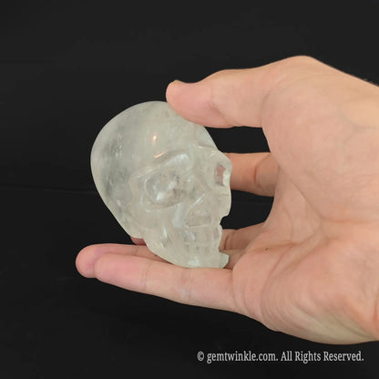 Top-down view of quartz skull carving showcasing authentic opaque and inclusion-rich mineral structure