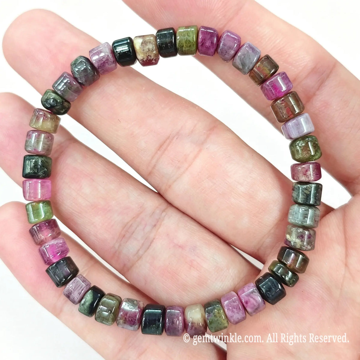 Full layout preview of multicolor tourmaline stretch bracelet on hand showing smooth bead polish
