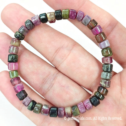 Full layout preview of multicolor tourmaline stretch bracelet on hand showing smooth bead polish