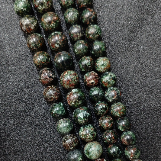 Natural seraphinite crystal beads grade c showing prominent reddish brown matrix and deep forest green patterns