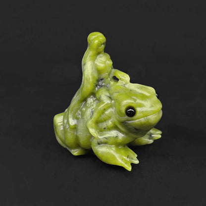 Front side view of a natural serpentine frog goddess statue featuring a detailed wood nymph riding a big eyed green toad