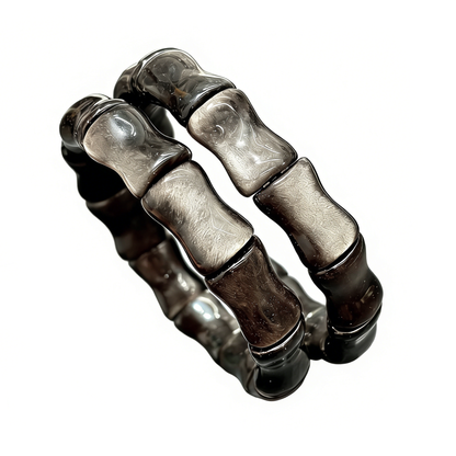 Natural Silver Sheen Obsidian Bamboo Bead Bracelet, 18cm stretch volcanic stone bangle, showcasing the metallic sheen and carved bamboo shape.