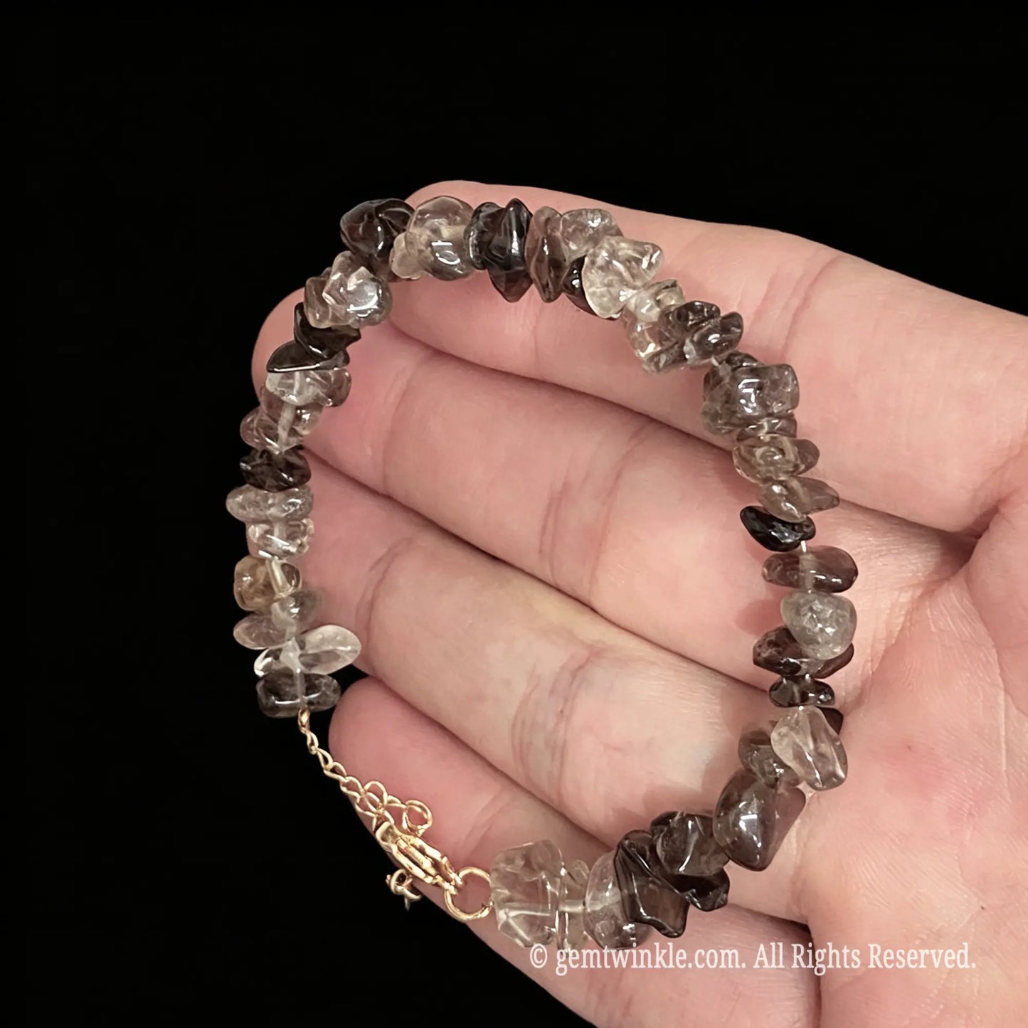 natural smoky quartz raw nugget bracelet displayed across hand showing tea brown clarity