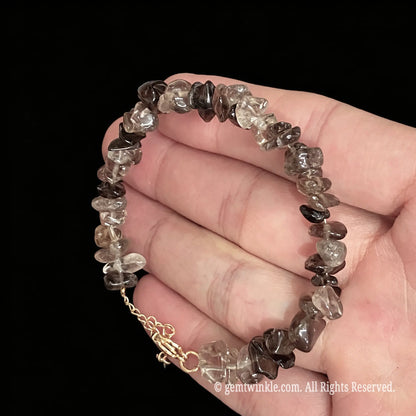 natural smoky quartz raw nugget bracelet displayed across hand showing tea brown clarity