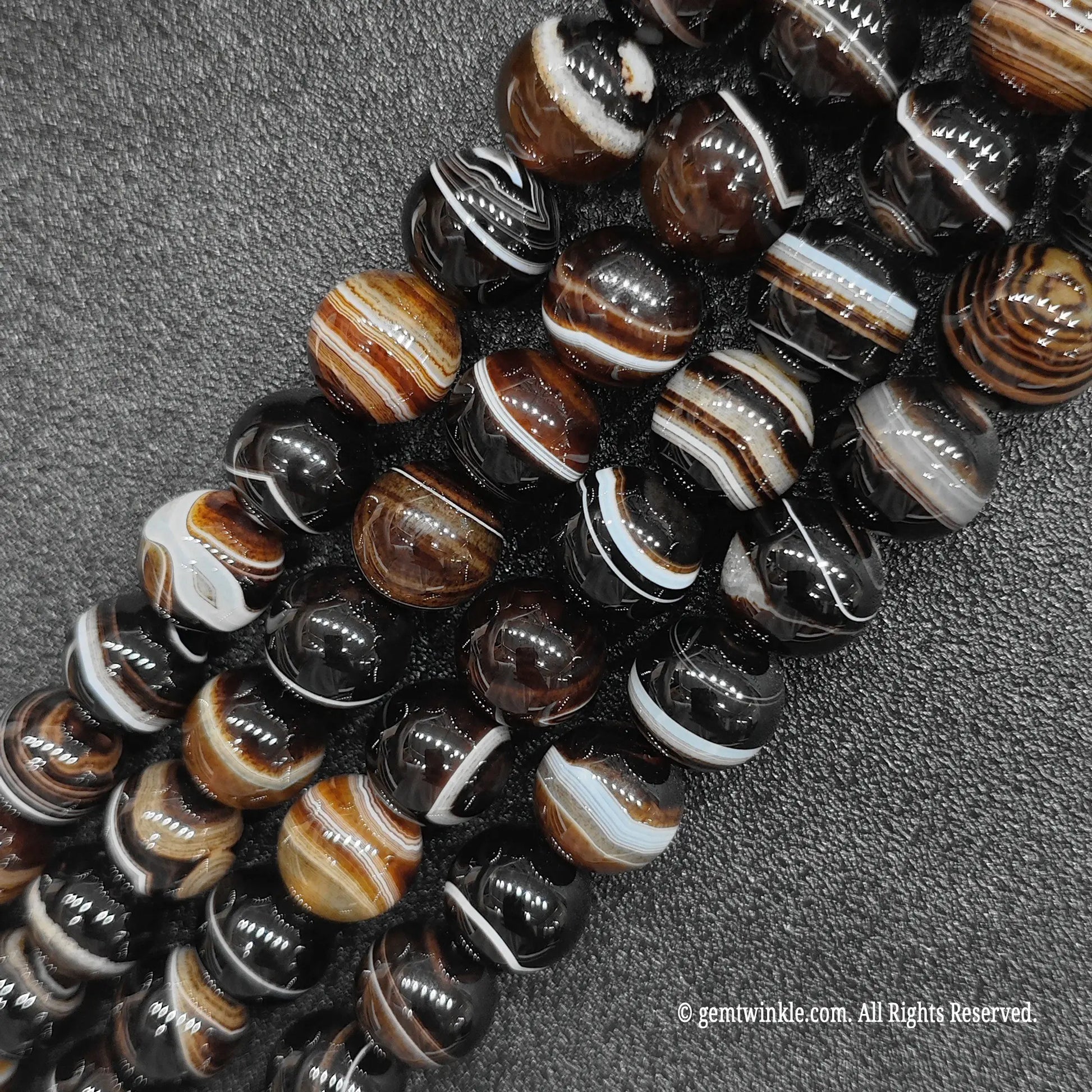 standard grade natural stones for jewelry making wholesale displaying high gloss polished round dyed grey silk agate bead lines