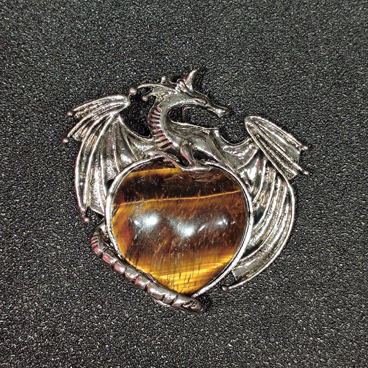Antique pewter-tone metal alloy dragon wrapped around natural yellow tiger eye heart cabochon