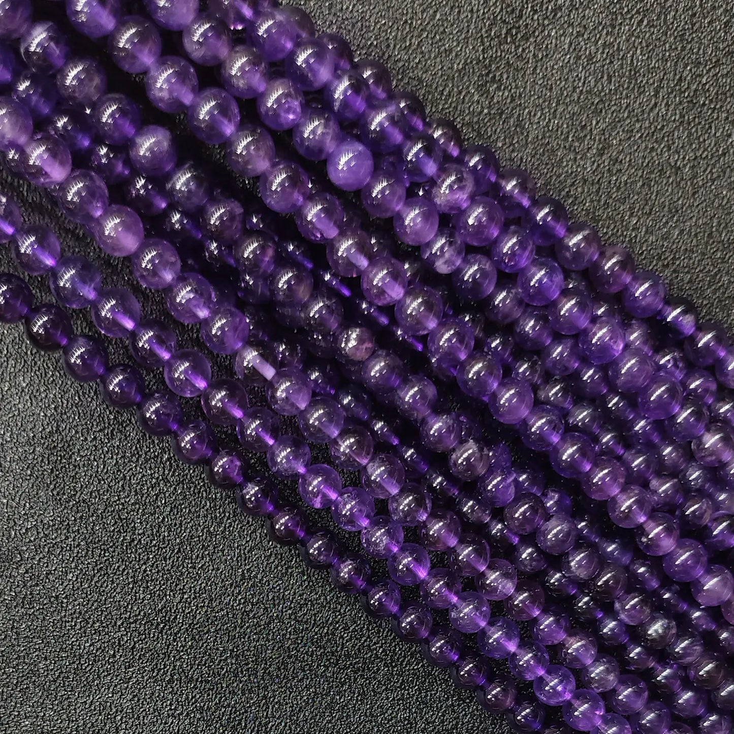 Natural grade b amethyst loose round beads strand with moderate natural inclusions and decent clarity