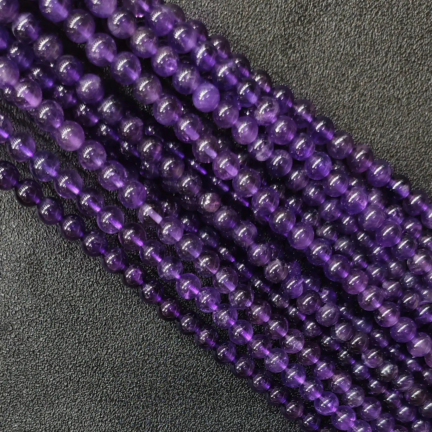 Natural grade b amethyst loose round beads strand with moderate natural inclusions and decent clarity