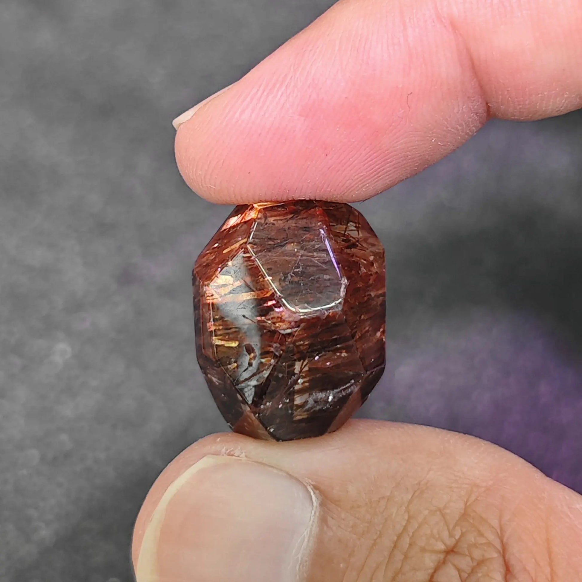 natural black gold super 7 quartz freeform faceted focal bead showing metallic lepidocrocite inclusions