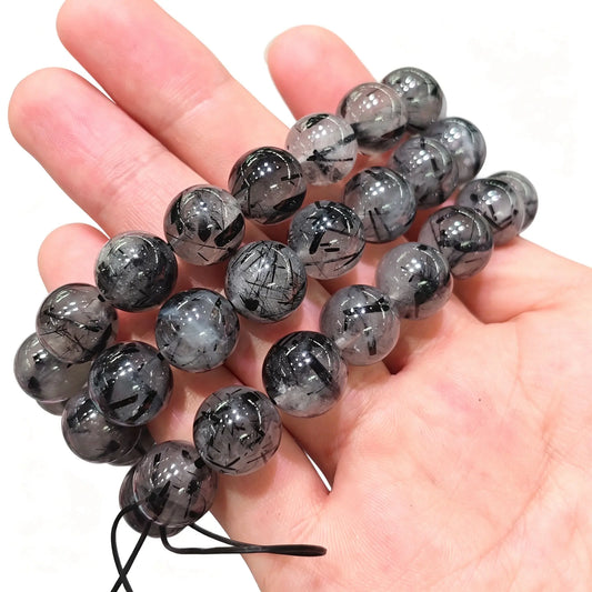 natural black tourmaline quartz round beads showing clear crystal matrix and black needle inclusions