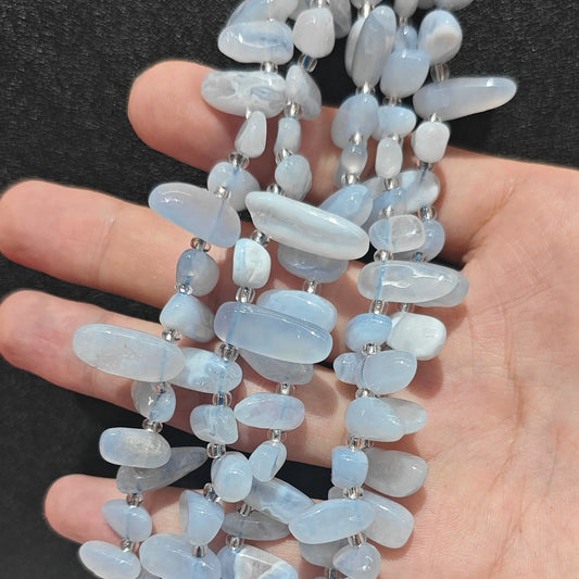 natural blue lace agate long drop loose bead strand displaying soft sky blue drops with natural white lace banding