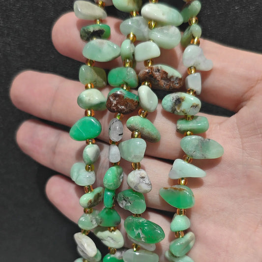 natural chrysoprase long drop loose bead strand displaying vivid apple green drops with brown matrix accents