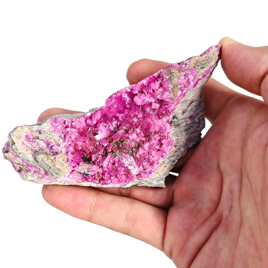 natural cobaltoan calcite druzy specimen showing vibrant magenta pink crystal cluster in matrix