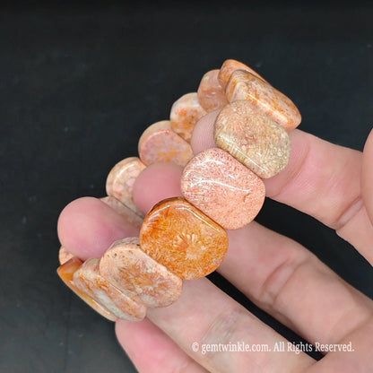 Natural fossil coral smooth rectangular bead bracelet side view highlighting rounded polished edges and uniform bead profile