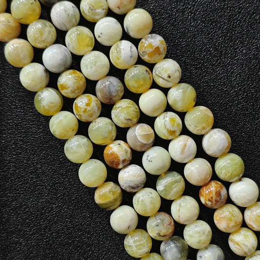 natural gemstone beads for jewelry making featuring genuine yellow opal matrix loose strands from 8mm to 10mm sizes on black background